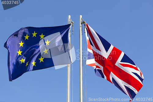 Image of European Union flag and flag of UK on flagpole