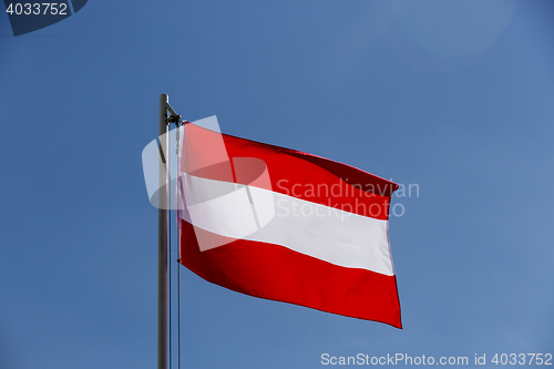 Image of National flag of Austria on a flagpole