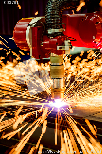 Image of CNC Laser plasma cutting of metal, modern industrial technology.