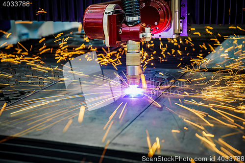 Image of CNC Laser plasma cutting of metal, modern industrial technology.