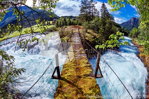 Image of Suspension bridge over the mountain river, Norway.