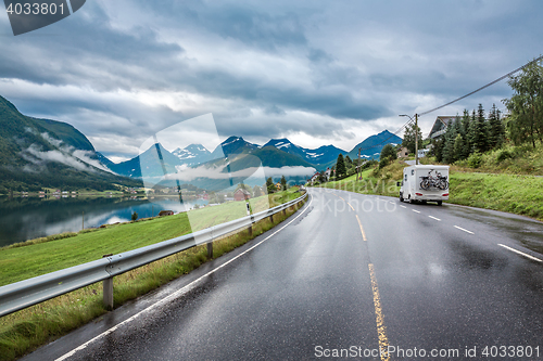 Image of Caravan car travels on the highway.