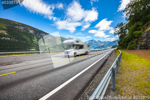 Image of Caravan car travels on the highway.