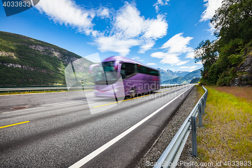 Image of Tourist bus traveling on the road in Norway