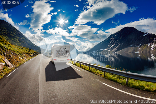 Image of Caravan car travels on the highway.