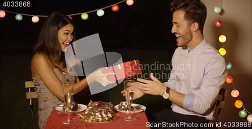 Image of Young woman giving a surprise Valentines gift