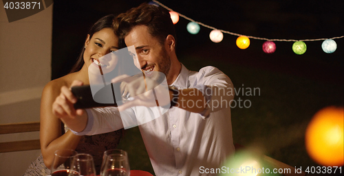 Image of Attractive young couple posing for a selfie