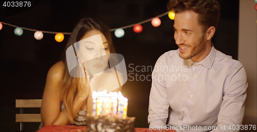 Image of Pretty young woman celebrating her birthday