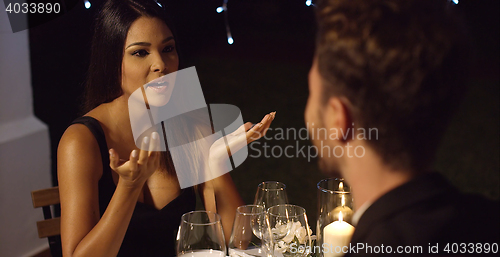 Image of Elegant young woman enjoying a dinner date