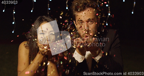 Image of Young couple celebrating New Year