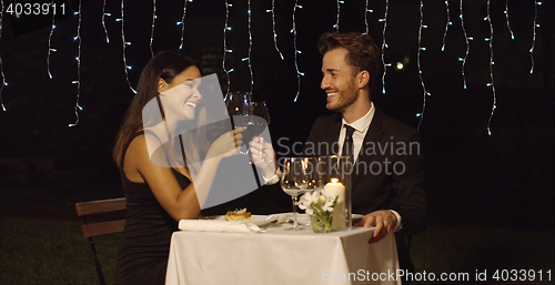 Image of Romantic couple dining in an elegant restaurant