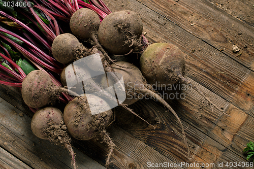 Image of Young beets on wooden table