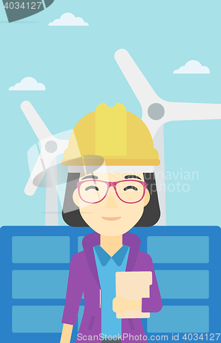 Image of Female worker of solar power plant and wind farm.