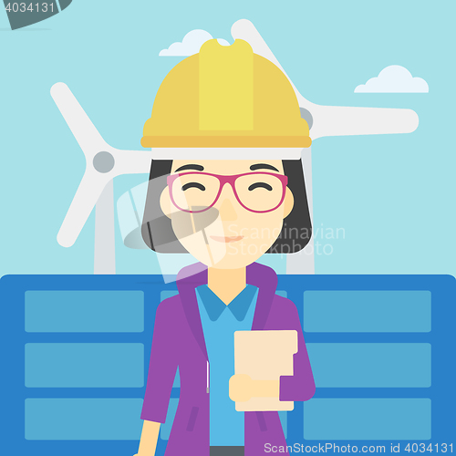 Image of Female worker of solar power plant and wind farm.
