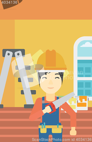 Image of Smiling worker with saw.