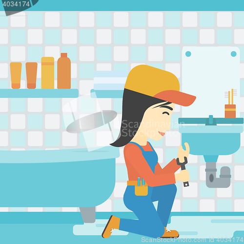 Image of Woman repairing sink.