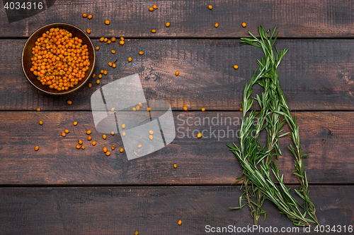 Image of Bunch of rosemary on wooden table, rustic style