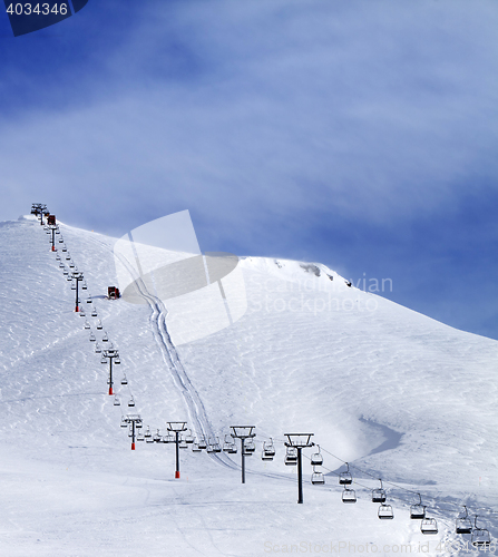 Image of Ski slope and chair-lift at morning