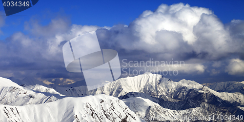 Image of Panoramic view on snowy ridges in sun winter day