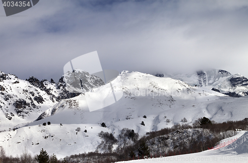 Image of Ski resort and sunlight mountains in clouds