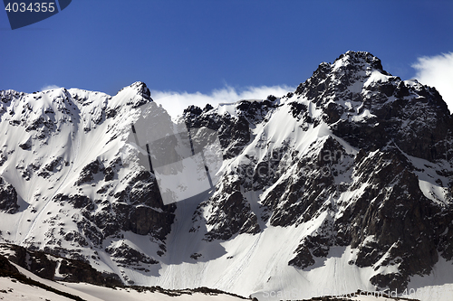 Image of Snow rocks at spring wind day