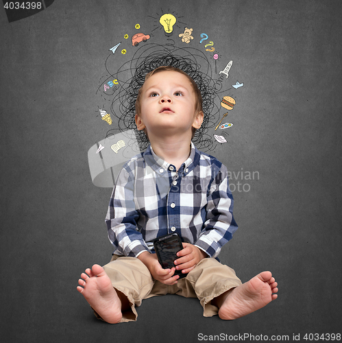 Image of Little boy thinking