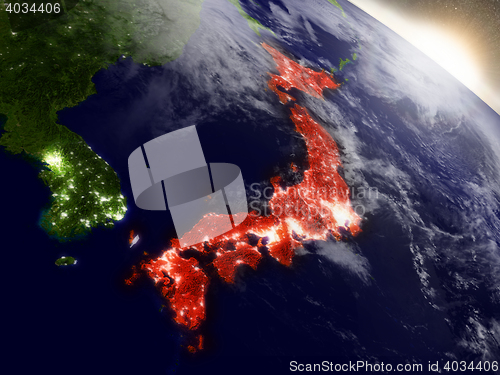 Image of Japan from space highlighted in red