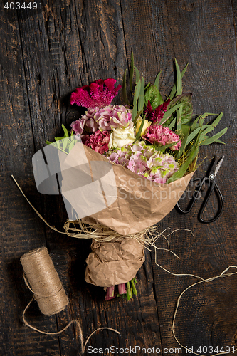 Image of The flowers on wooden background