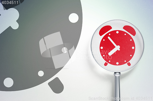 Image of Time concept:  Alarm Clock with optical glass on digital background