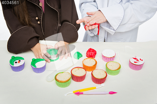 Image of Closeup of funny christmas cupcakes