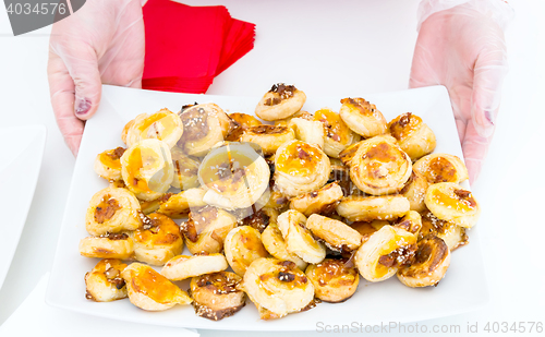 Image of cookies of puff pastry with sesame seeds