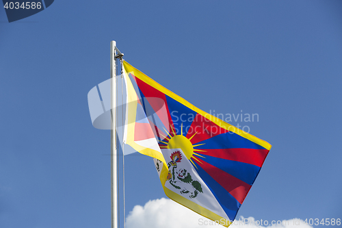 Image of National flag of Tibet on a flagpole