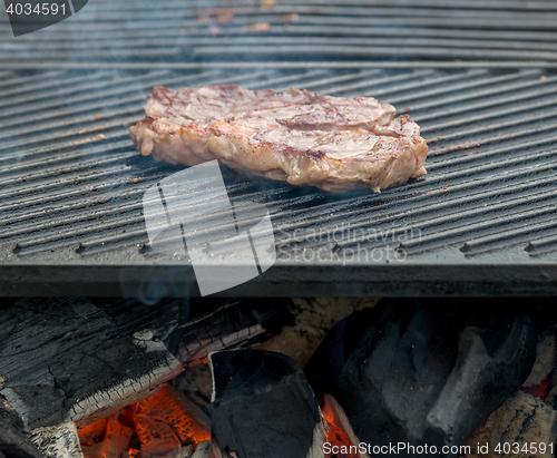 Image of beef steaks on the grill