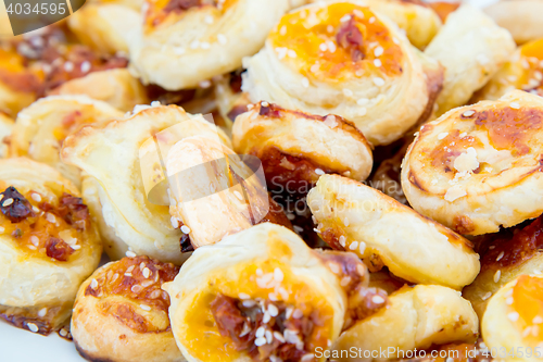 Image of cookies of puff pastry with sesame seeds