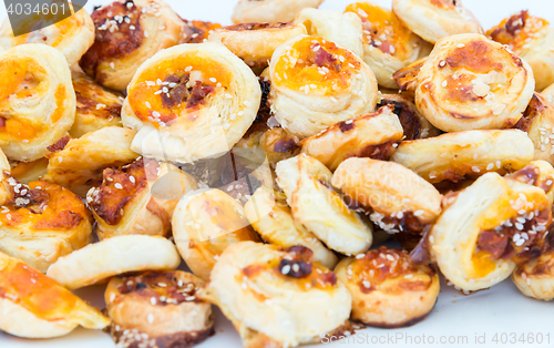 Image of cookies of puff pastry with sesame seeds