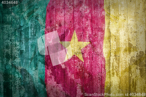 Image of Grunge style of Cameroon flag on a brick wall