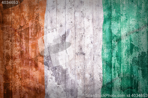 Image of Grunge style of Ivory Coast flag on a brick wall