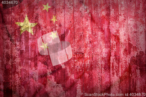 Image of Grunge style of China flag on a brick wall