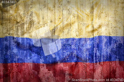 Image of Grunge style of Colombia flag on a brick wall