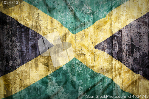 Image of Grunge style of Jamaica flag on a brick wall