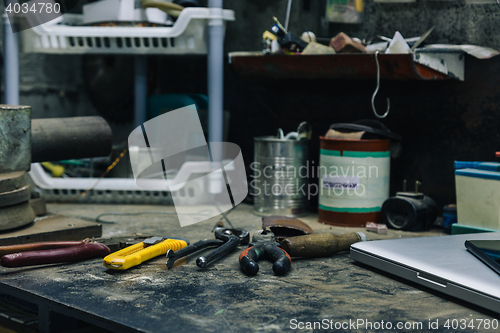 Image of Top view of old tools,laptop and phone on table