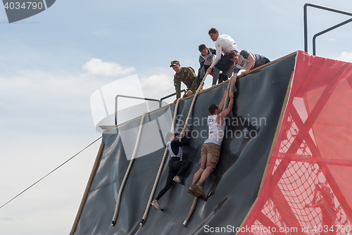 Image of Sportsmen storms big wall in extrim race. Tyumen