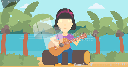 Image of Musician playing acoustic guitar.