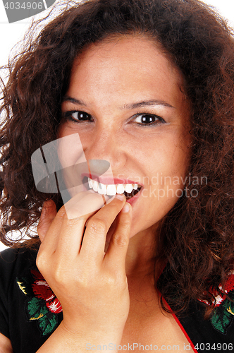 Image of Woman biting her nails.