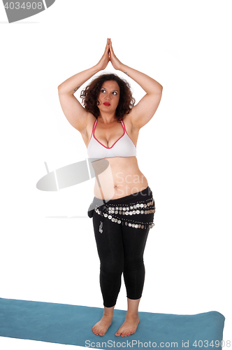 Image of Belly dancing young woman.