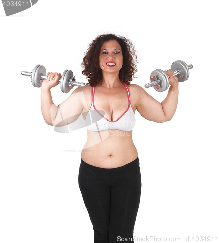 Image of Woman lifting dumbbells.