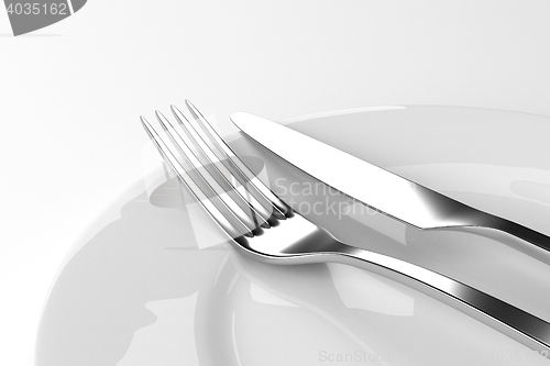 Image of Fork and knife with plates