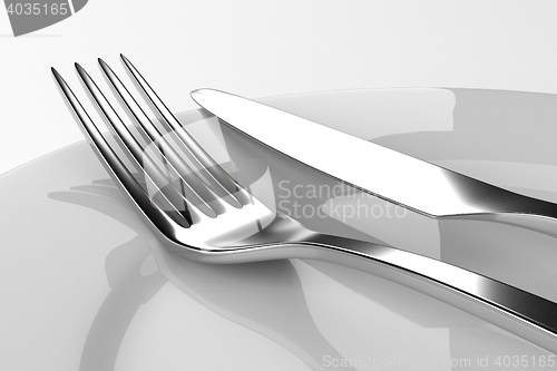 Image of Fork and knife with plates