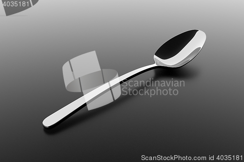 Image of Silver spoon on a table