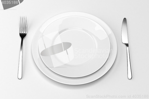 Image of Fork and knife with plates